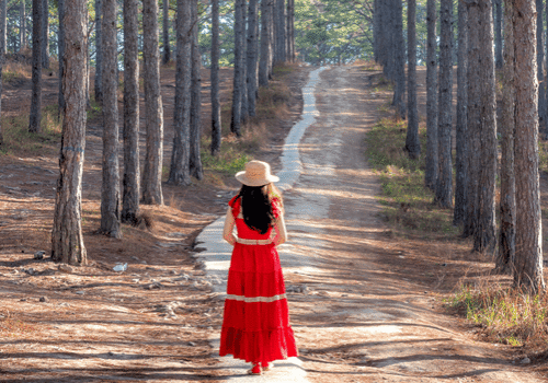 A woman confidently stepping forward on a clear path